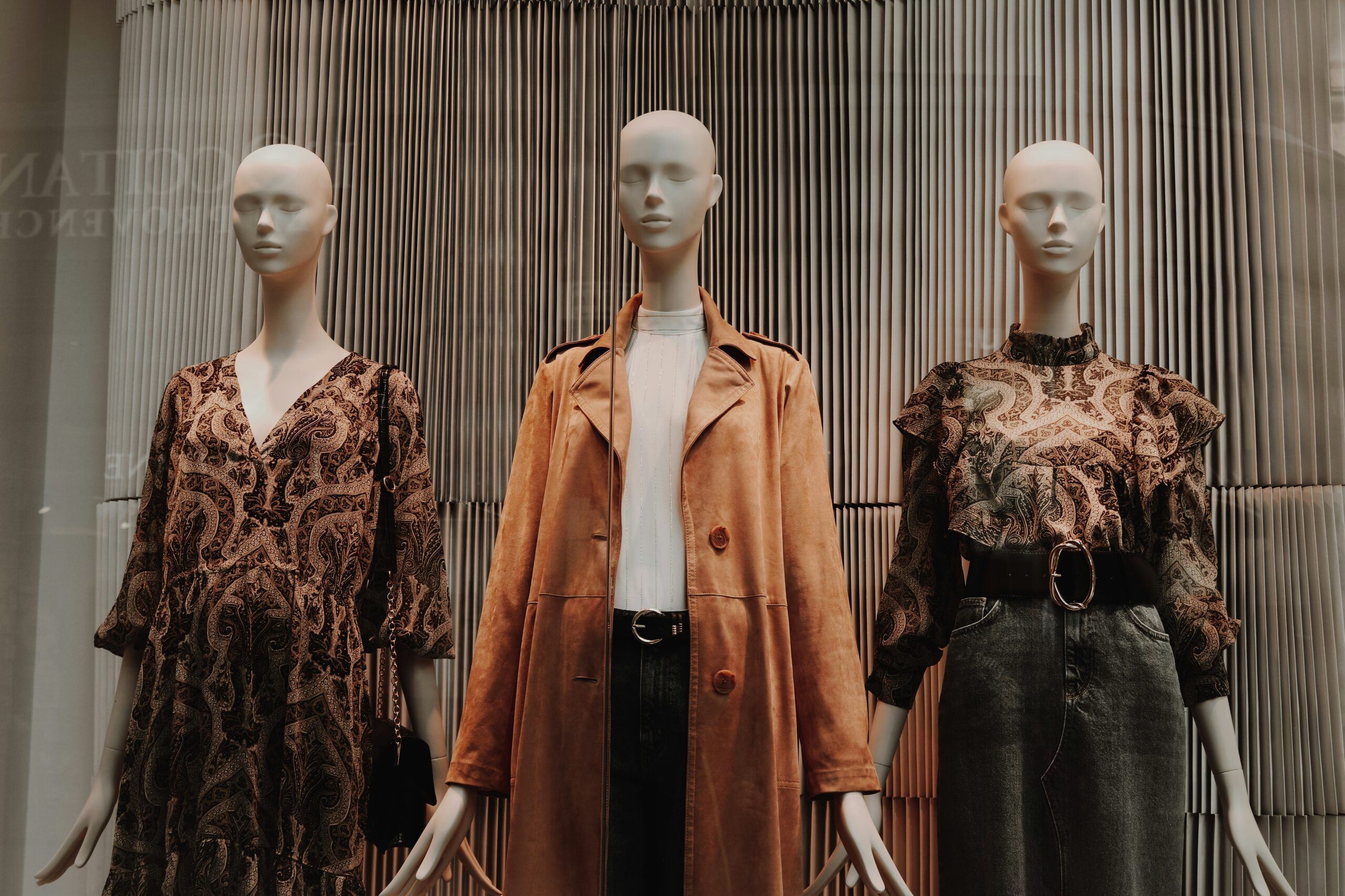 mannequin in brown coat and black skirt